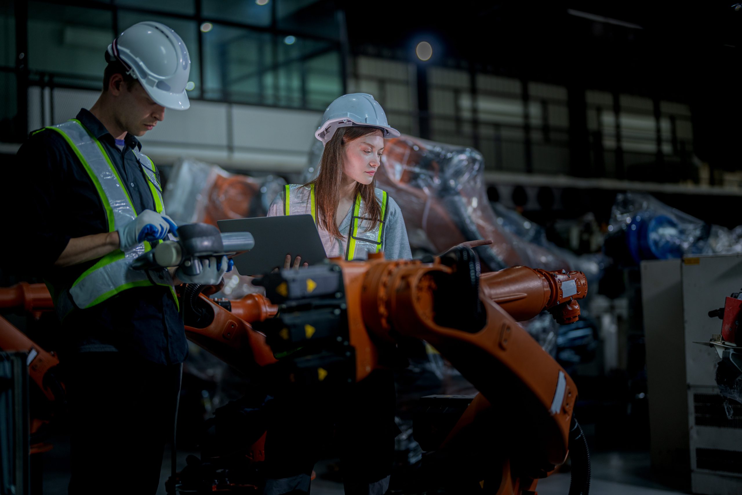 team engineers inspecting on machine with smart tablet. Worker w