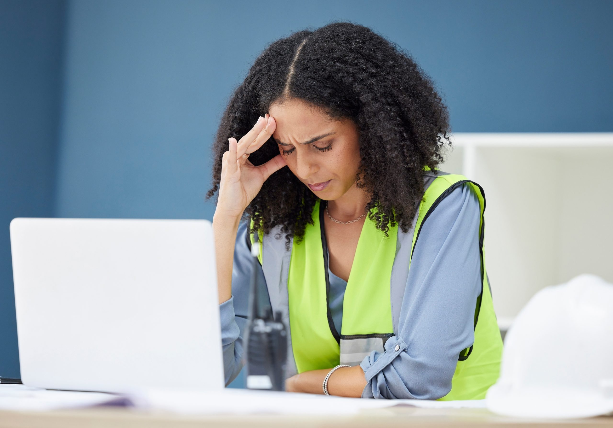 construction-stress-and-woman-engineer-at-laptop-2025-04-06-10-54-08-utc
